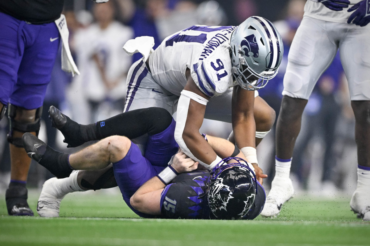 Dec 3, 2022; Arlington, TX, USA; Kansas State Wildcats defensive end Felix Anudike-Uzomah (91) sacks TCU Horned Frogs quarterback Max Duggan (15) during the second half at AT&T Stadium. Mandatory Credit: Jerome Miron-USA TODAY Sports